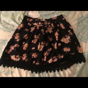 Black floral mini skirt